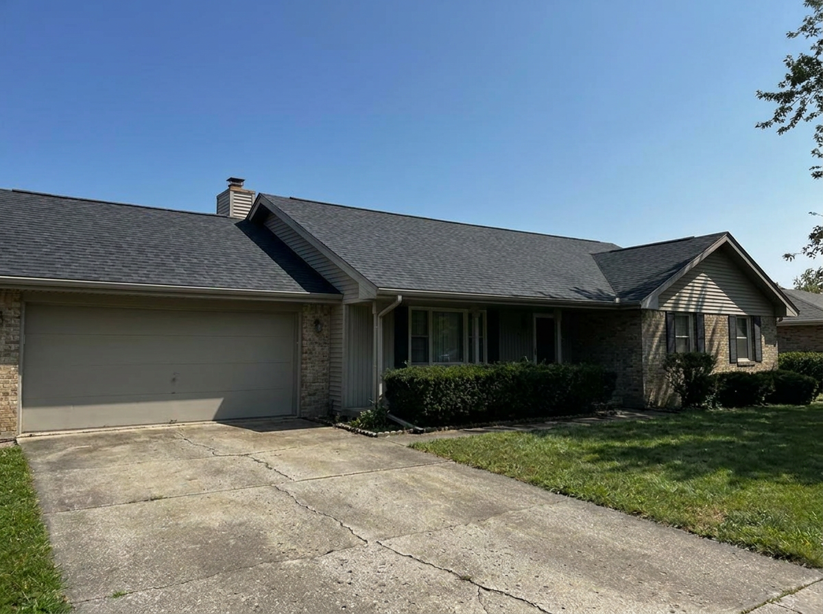 Same roof fully repaired with new matching shingles after storm damage